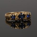 A Victorian 18ct gold ring set with sapphires and diamond chips, assayed Birmingham 1897, size Q.