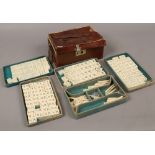 An early 20th century Chinese Mahjong set, in leather case.