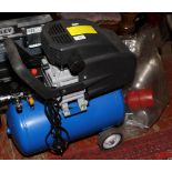 A new and unused 24 litre air compressor along with a bag of spray guns.