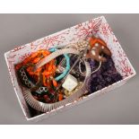 A box of costume jewellery and collectables including beads, Cleopatra necklace and coin bangles