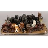 A tray lot of ornamental animals to include Ebony & Horn tusk elephants, wooden horse carvings etc.