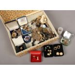 A box of costume jewellery including chains, pendant, earrings, brooches etc.