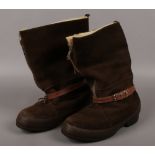 A pair of World War II RAF brown suede flying boots with sheep skin lining with military broad arrow