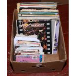 A box of L.P and single records to include The Clash, Wings, Shakin Stevens etc.