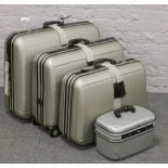 A set of three graduated antler suitcases along with an antler vanity case.