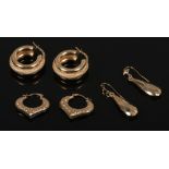 Three pairs of 9ct gold earrings including creole, textured hoops and faceted drops (Total weight