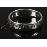 An engraved silver bangle by Charles Horner, assayed Birmingham 1968.