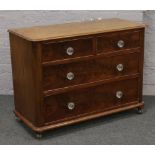 A Victorian mahogany chest of four drawers with glass handles and raised on easyfree runners.