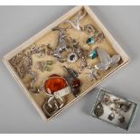 A tray of silver oddments etc including amber pendant, earrings and charms etc.