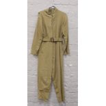 Two World War II original USA AF A4 flight suits one olive tan and one light tan along with a set of