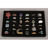 A display case of 36 dress rings to include white and colour paste stone examples.