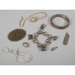 A collection of mainly silver and white metal jewellery to include bangle charm bracelet,ingot etc.