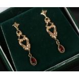 A cased pair of 9ct gold garnet pendant earrings.