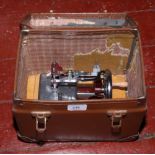 A cased child's Essex miniature sewing machine.