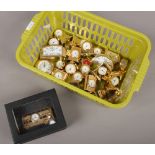 A collection of 23 miniature brass cased novelty timepieces.