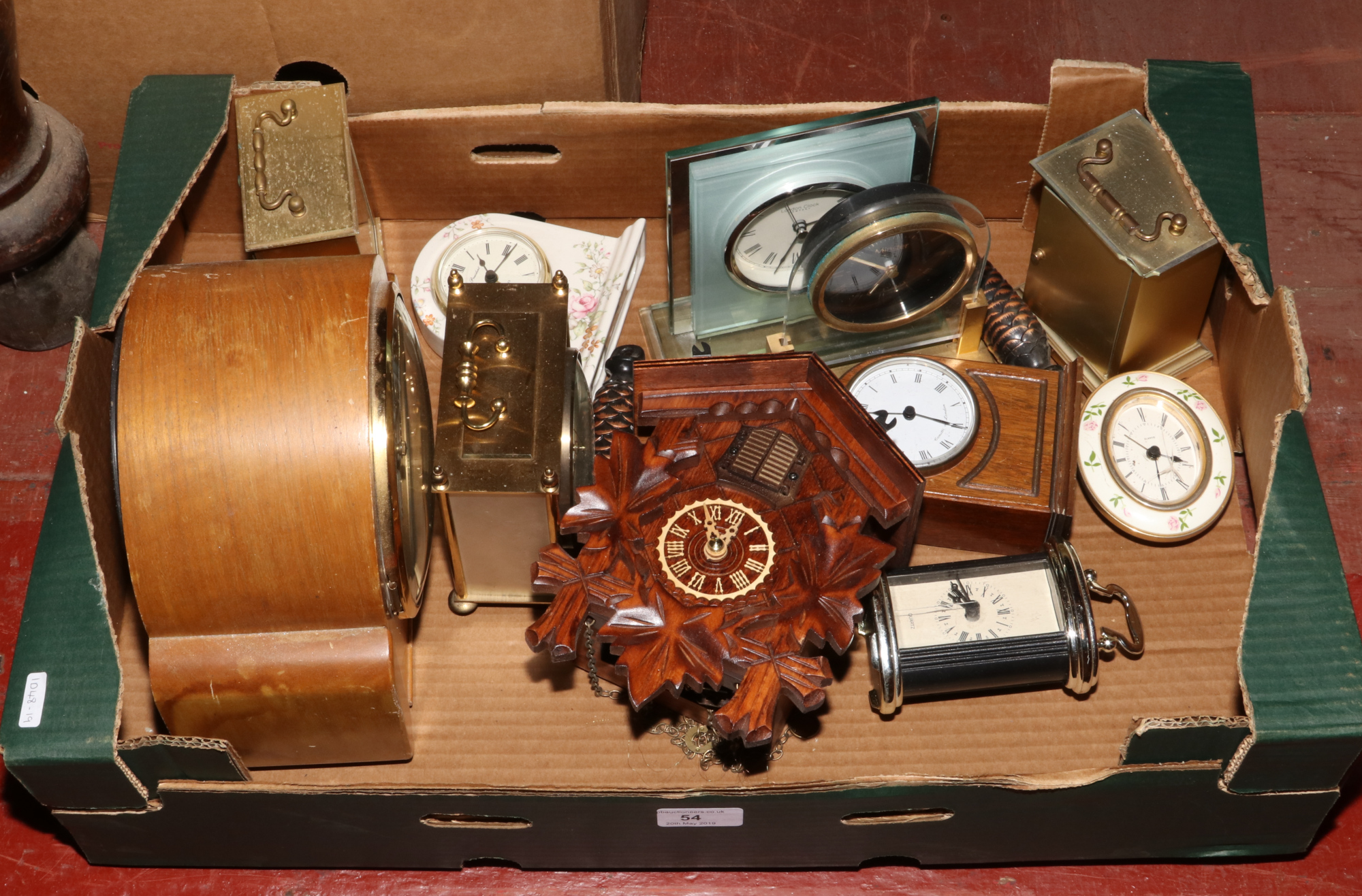 A box of clocks to include mantle clocks, wall mounted cuckoo clock etc.