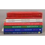 Eight stamp collectors guides / catalogues, mainly Stanley Gibbons examples.