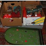 Two boxes of mostly vintage games and toys include tin train, garden golf set, bagatelle board etc.