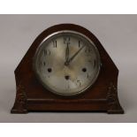 An oak Westminster / Whitington chime mantel clock with silvered dial, pendulum and key with