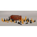 A complete cased Bakelite chess set made by The Gray of Cambridge.