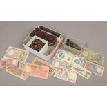 A tin of miscellaneous coins and bank notes to include crowns, farthings, metal detector finds etc.