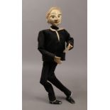 A plaster puppet in evening dress attire.