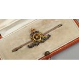 A cased gold Royal Artillery sweet heart brooch, by Goldsmith & Silversmith.