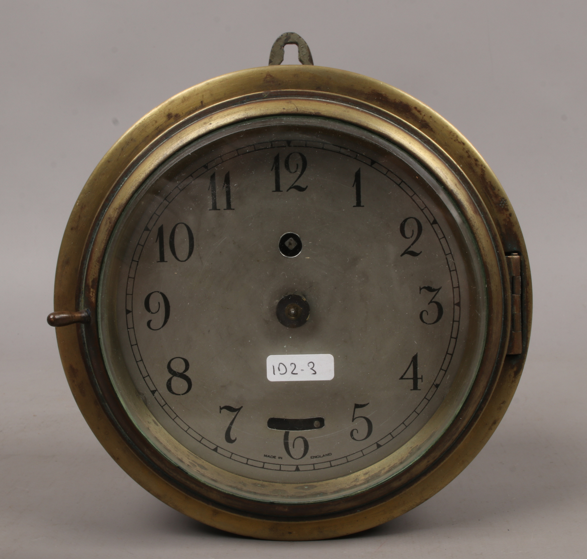 A brass and galvanised steel cased ships clock with French movement.Condition report intended as a