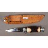 A J Nowill & Sons antler handled knife in leather sheath.