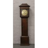 A Georgian oak 30 hour longcase clock with brass dial signed John Woodall / Willis Harthill with