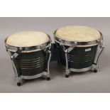 A pair of painted hardwood and chrome bongos.