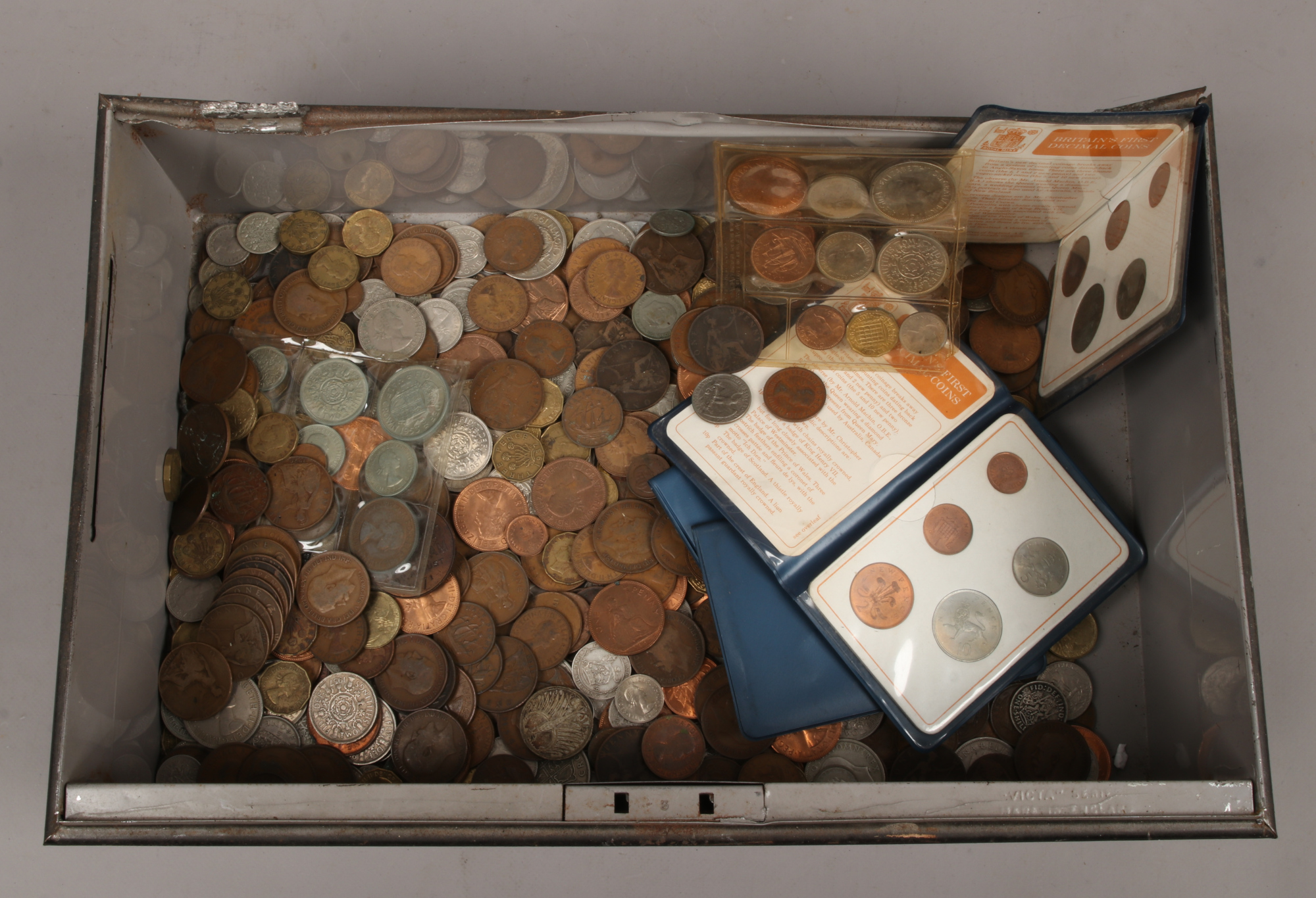 An old steel deed box and contents of mixed silver and copper pre-decimal coins along with 5