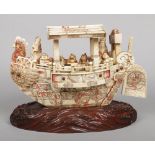 A large Japanese Meiji period carved ivory and bone Takarabune. The figurehead formed as the head of