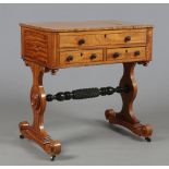 A Regency satinwood vanity table with ebonized mouldings and raised on twin lyre supports, 70cm