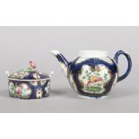 A Worcester butter tub and cover with flower moulded knop and a globular teapot. Both scale blue