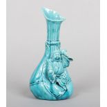 A Burmantofts Faience vase designed by Joseph Walmsley. Modelled as a small Chinese worker resting