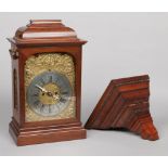 A mahogany cased 8 day bracket clock striking hourly on a bell. With relief work brass dial mask and