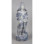 A large Chinese blue and white porcelain sculpture. Formed as a female warrior, clad in armour,