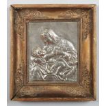 A 19th century Continental gilt framed relief work white metal plaque, portrait of the Madonna and
