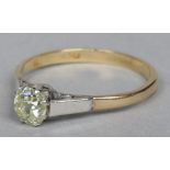 An 18 carat gold diamond solitaire ring  Set with a slightly tinted square old mine cut stone