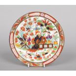 A very rare Worcester Barr, Flight & Barr plate painted in the Imari style with three Oriental