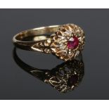 A George V 18 carat gold ruby and diamond cluster ring. Assayed Birmingham 1916, size P.