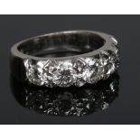 An 18 carat white gold five stone diamond ring. Set with five brilliant cut diamonds approximately