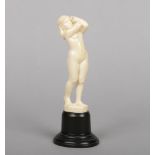 A 19th century Continental carved ivory figure, possibly Dieppe. Formed as a standing naked female