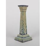 A Burmantofts Faience lustre square formed candlestick on stepped base by Joseph Walmsley. Painted