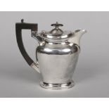 A George V silver hot water jug by Cooper Brothers & Sons Ltd. Assayed Sheffield 1930, 717 grams