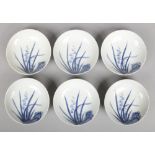 Six Japanese Nabeshima style blue and white dishes. Painted with flowers and leaves in underglaze