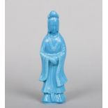 A Chinese Peking glass figure of Guanyin in opaque blue, 26.5cm.