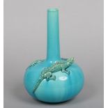 A Burmantofts Faience bottle vase. Surmounted to the shoulder with a moulded lizard and two