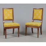 A pair of French Empire mahogany side chairs.